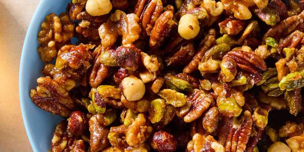 Close-up of a bowl filled with mixed roasted nuts.