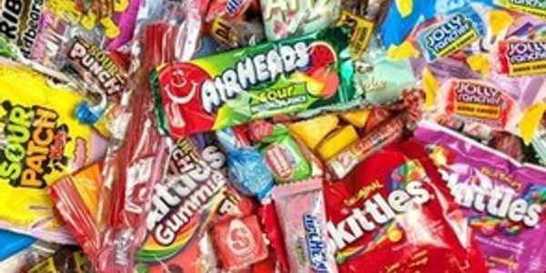 A colorful assortment of popular candy packs and sweets.
