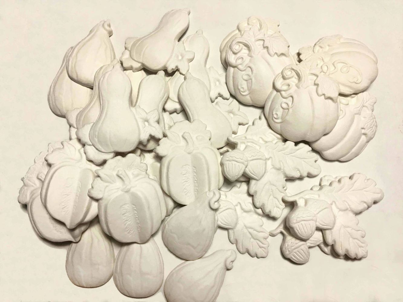 ceramic unpainted white clay fall squash autumn gourds oak leaves a acorns Camille Stancin LA artist