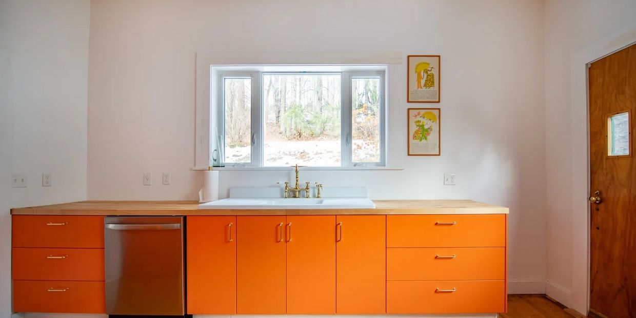 Historic home restoration and kitchen remodeling by HNDY boutique design-build firm. This Hamden House renovation features custom orange cabinetry and precision fine carpentry, showcasing the same intentionality we bring to every Brooklyn brownstone renovation.