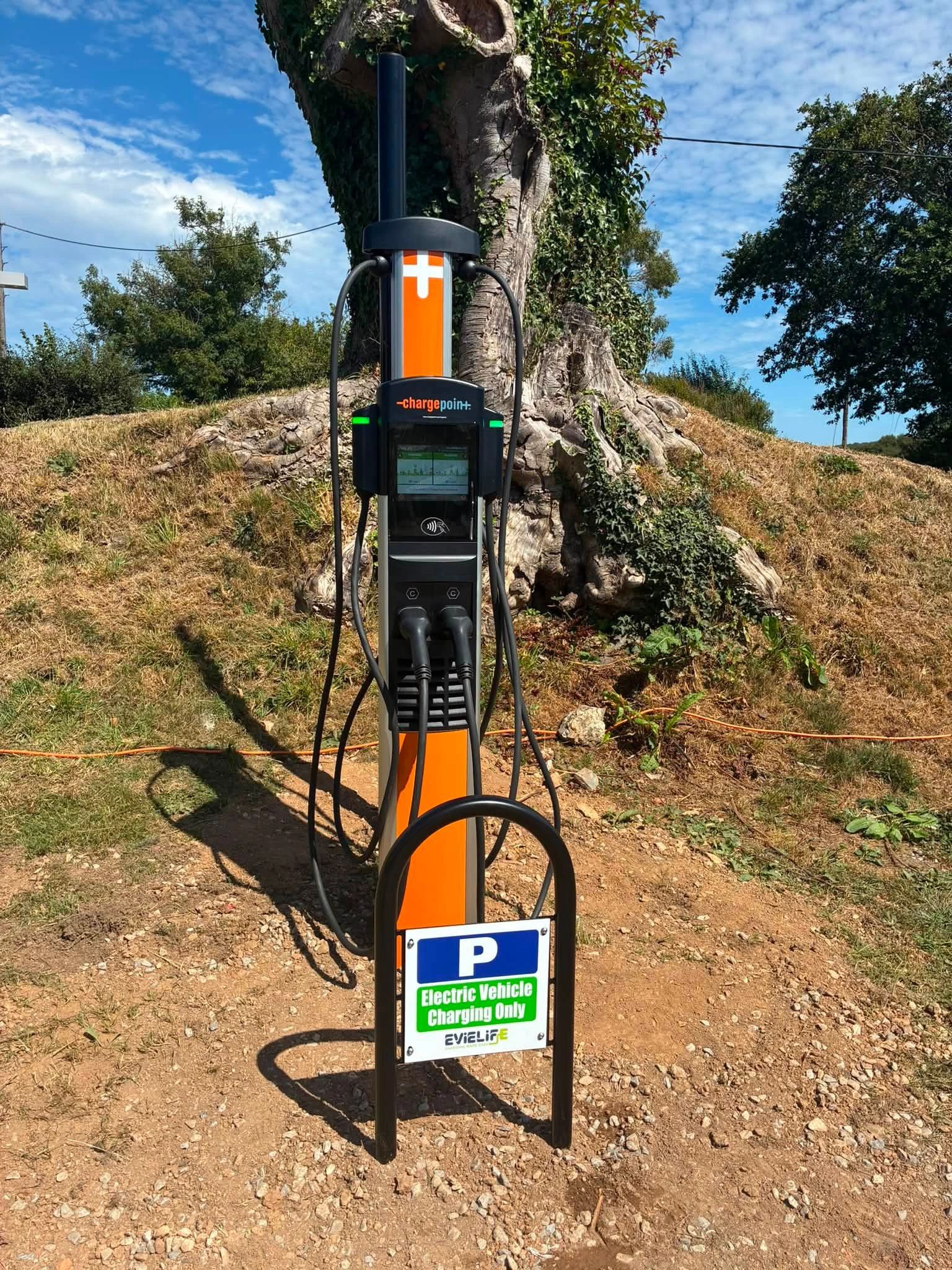 Electric vehicle charging station outdoors.