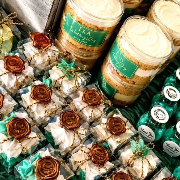 Elegant wedding favors with wax seals and personalized labels for I&amp;A's special day.