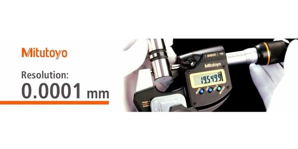 Mitutoyo digital micrometer with 0.0001 mm resolution measuring a cylindrical object.