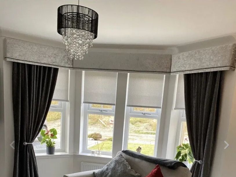 Window with made to measure curtains and pelmets.