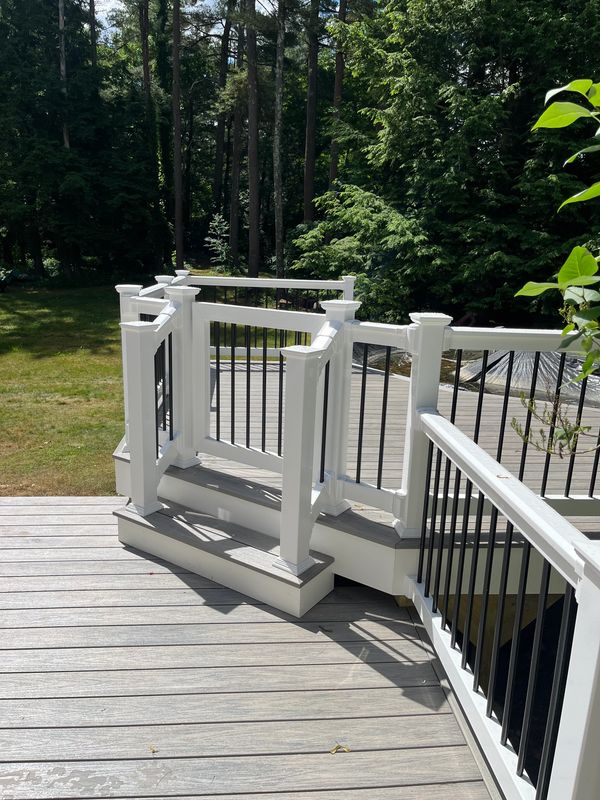 Deck attached to home leading to a pool deck