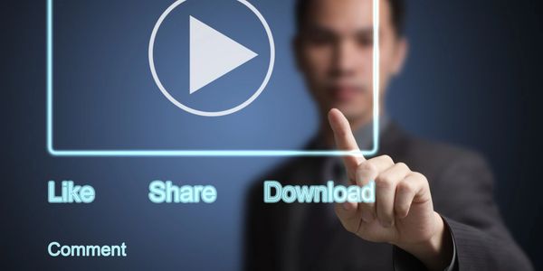 Man interacting with virtual video interface, selecting download option.