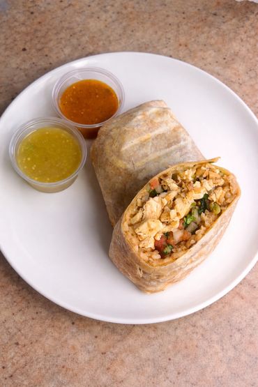 Grilled chicken Burrito
rice, beans, lettuce, pico de Gallo, cheese and home made salsa 