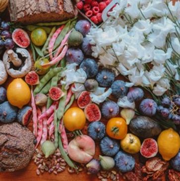 Image from the Fertility Business book of colorful fruits, vegetables, and flowers.