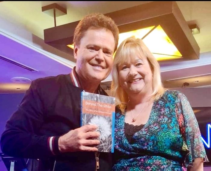 Giving a copy of my book to Donny Osmond 