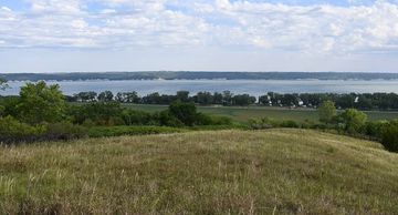 Discover 5-acres of lakefront possibility in Cedar Ridge Development on the Nebraska side of Lewis a