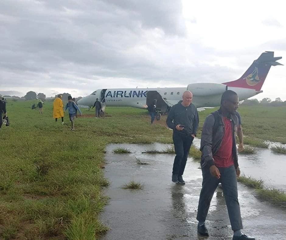 Airlink plane slips off a wet runway while landing in Mozambique.