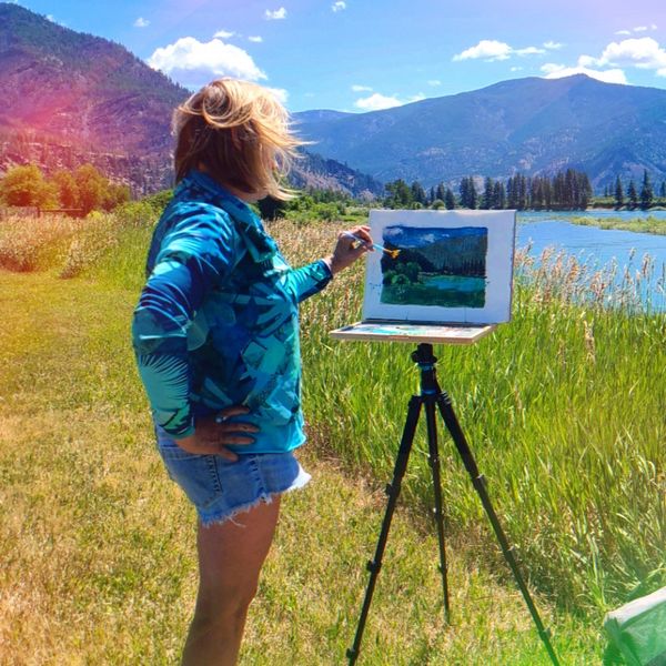 Photo of Kirsten painting en plein air near Paradise, Montana