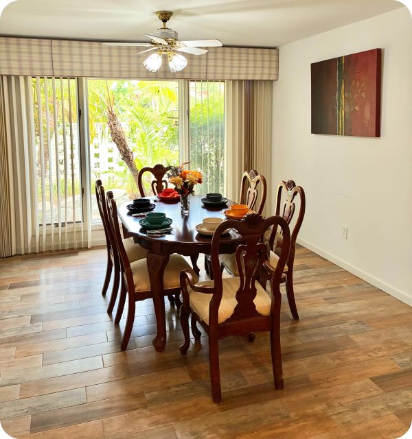 Elegant dining room with wooden furniture and natural light.