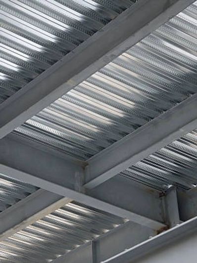 Close-up of a metallic beam ceiling structure.