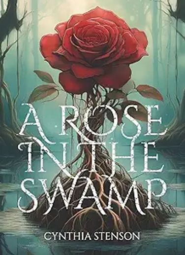 A blooming red rose atop a small mound of soil peeking from water,  foggy blue background of trees.