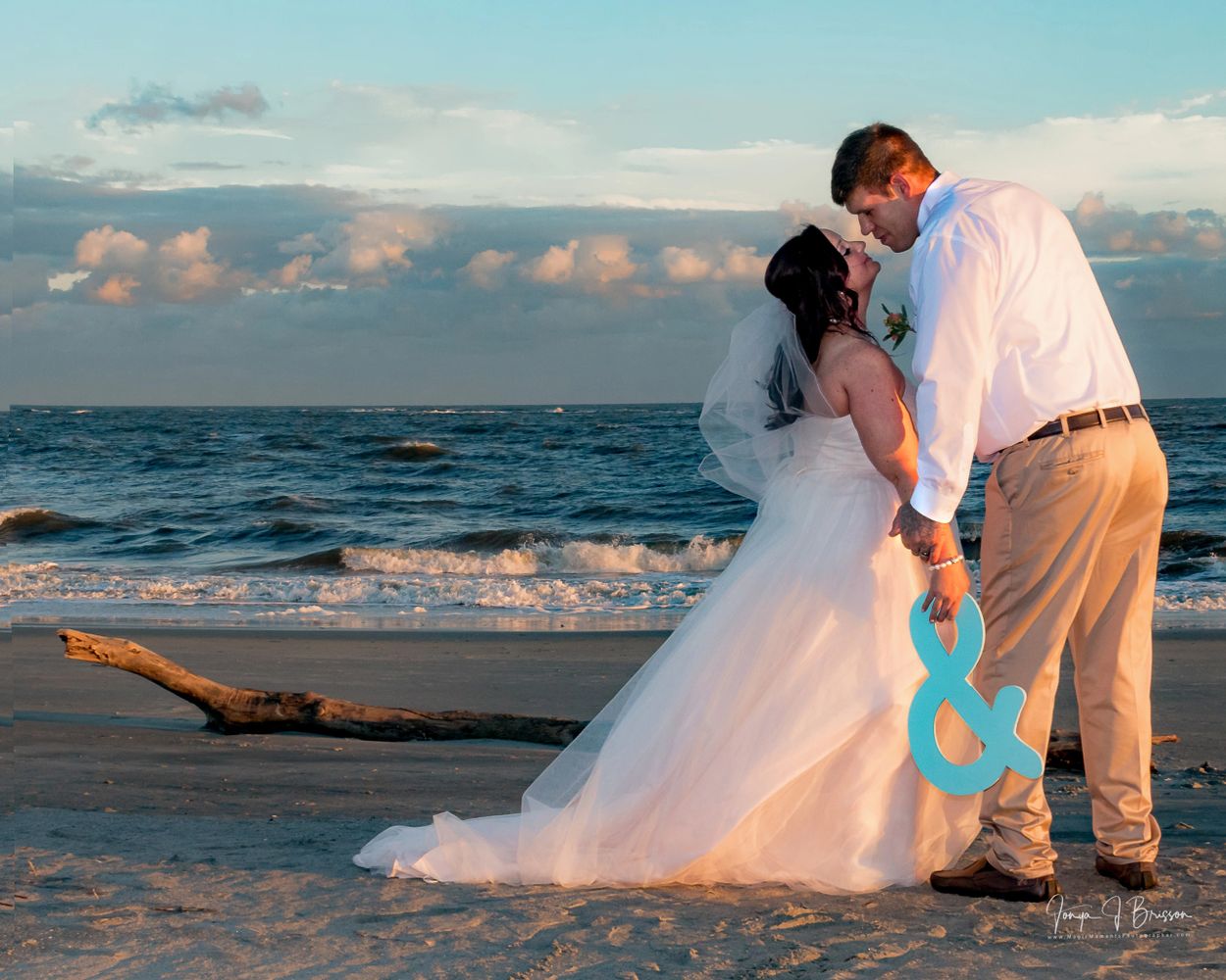 Bride and groom kissing on a beach on Isle of Palms, SC
