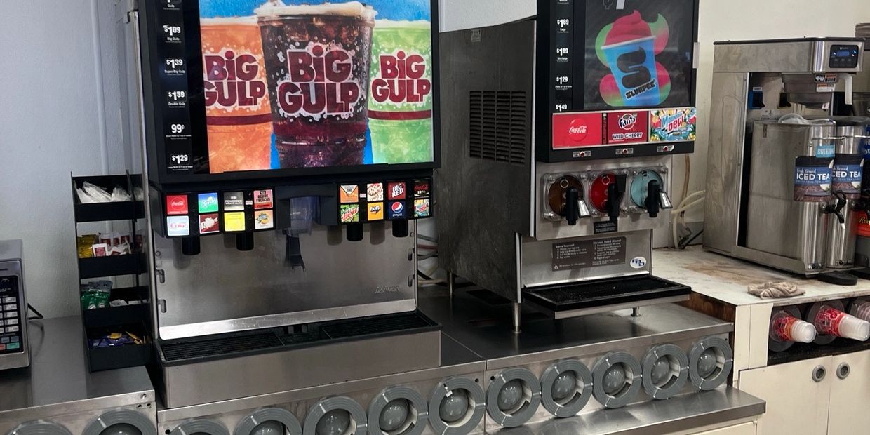 Lancer soda dispenser and Slurpee machine in a retail beverage station