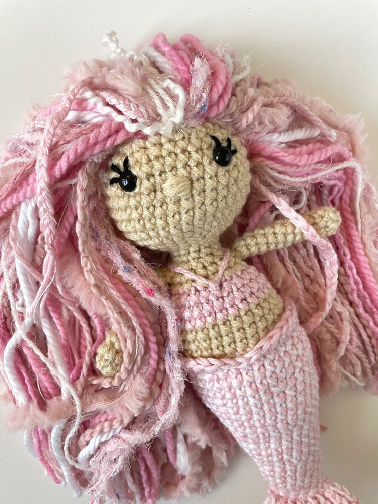 Crocheted mermaid doll with pink hair