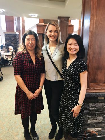 Three women smiling.