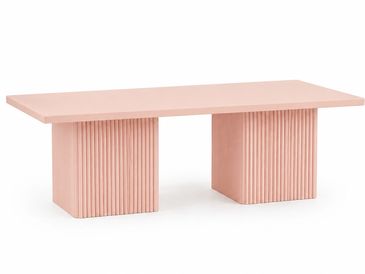 Pink rectangular table with ribbed pedestal legs.