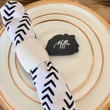 Elegant table setting with black and white theme.