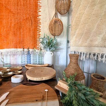 Decorative home items with woven baskets and wooden boards.