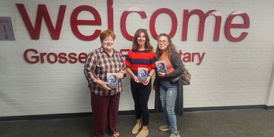 Kiwanis members provided dictionaries for every 3rd grader at GI Elementary School.