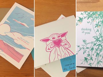 3 letterpress cards with commissioned writing: a sun with mountains, Baby Yoda with a heart, Vines.