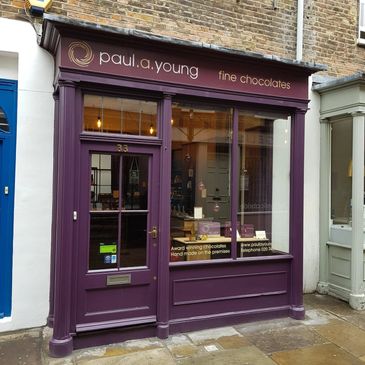 A purple shop front door recently repaired.