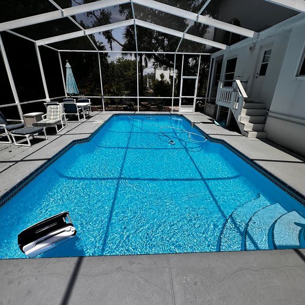 Adding chlorine and balancing chemicals for safe swimming water