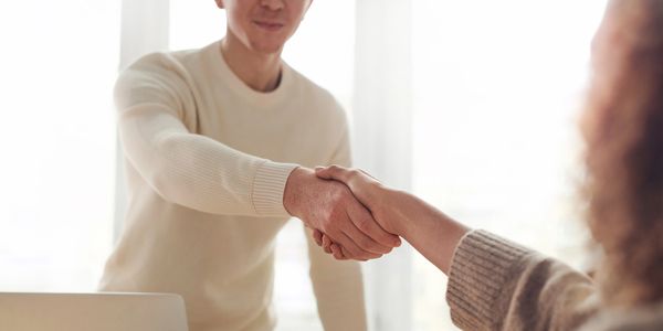 A man and a woman shaking hands