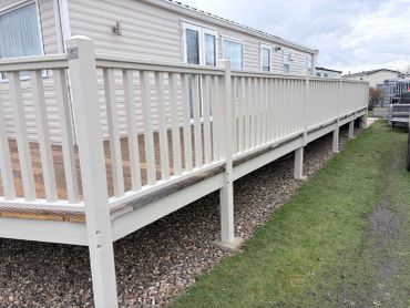 White railing on a mobile home deck.