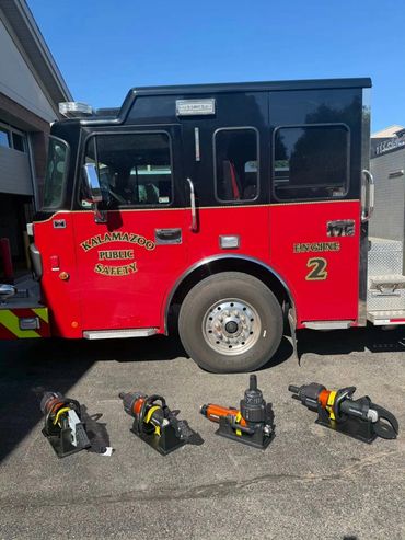 Kalamazoo fire engine with rescue tools displayed in front.