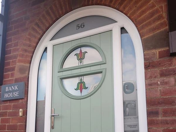 Arched top light and frame on new front door fitted in Nottinghamshire by our trained installers.