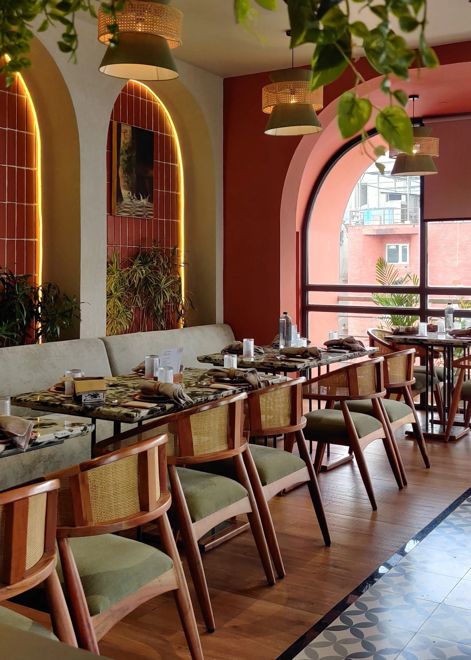 Stylish restaurant interior with warm lighting and wooden furniture.