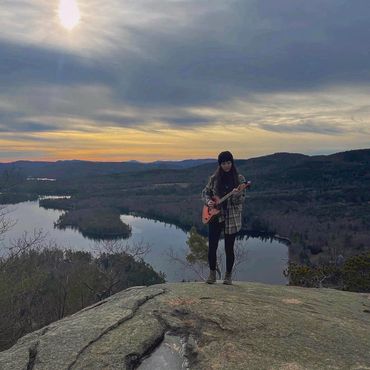 Dani Sven performing on mountain top in New Hampshire