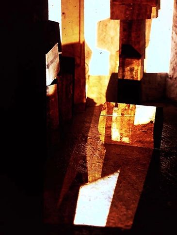 Sculptural shapes with light projection. Dark shade and illumination.