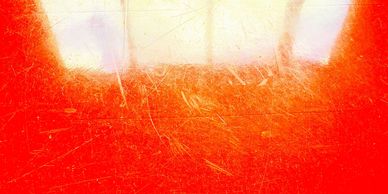 Illumination revealing incidental marks and quiet histories of everyday movement.