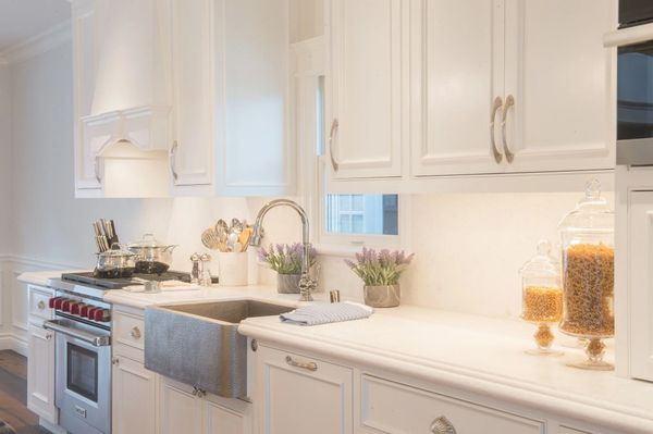 Updated kitchen all white with professional gas stove
