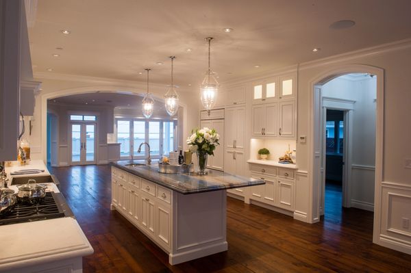 The center island in the kitchen with outgoing archway.