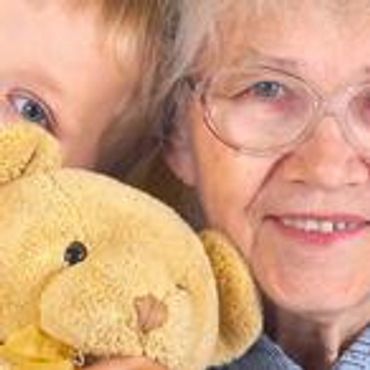 Senior woman with child and teddy bear