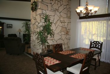 Dining table near stone wall and plant