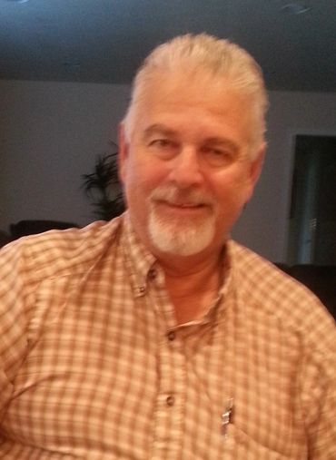 Portrait of a smiling man with a beard