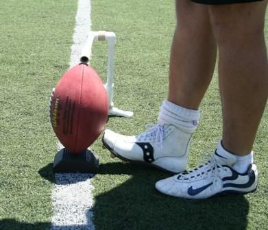 Ken Olson wearing football square toe kicking shoe makes football impact with straight on technique