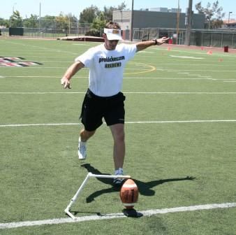 Ken Olson taking plant step wearing square toe football shoe for straight on kicking front
