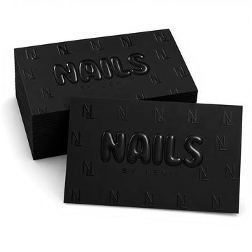 Black business cards with embossed "NAILS" text and subtle patterned background.