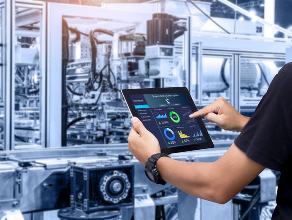 Engineer working in the manufacturing sector with a digital tablet