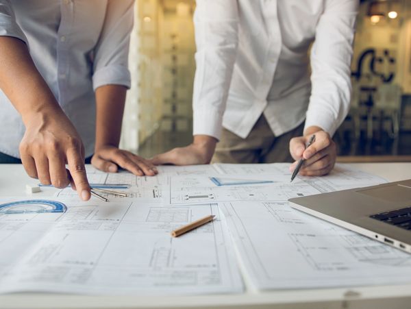 Two people working on project management
