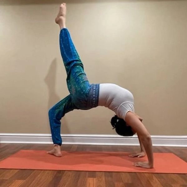 A woman doing a yoga inside the house