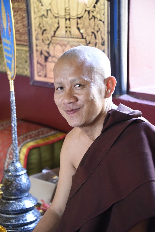 Thailand, Chiang Rai Buddhist Temple, smiling monk